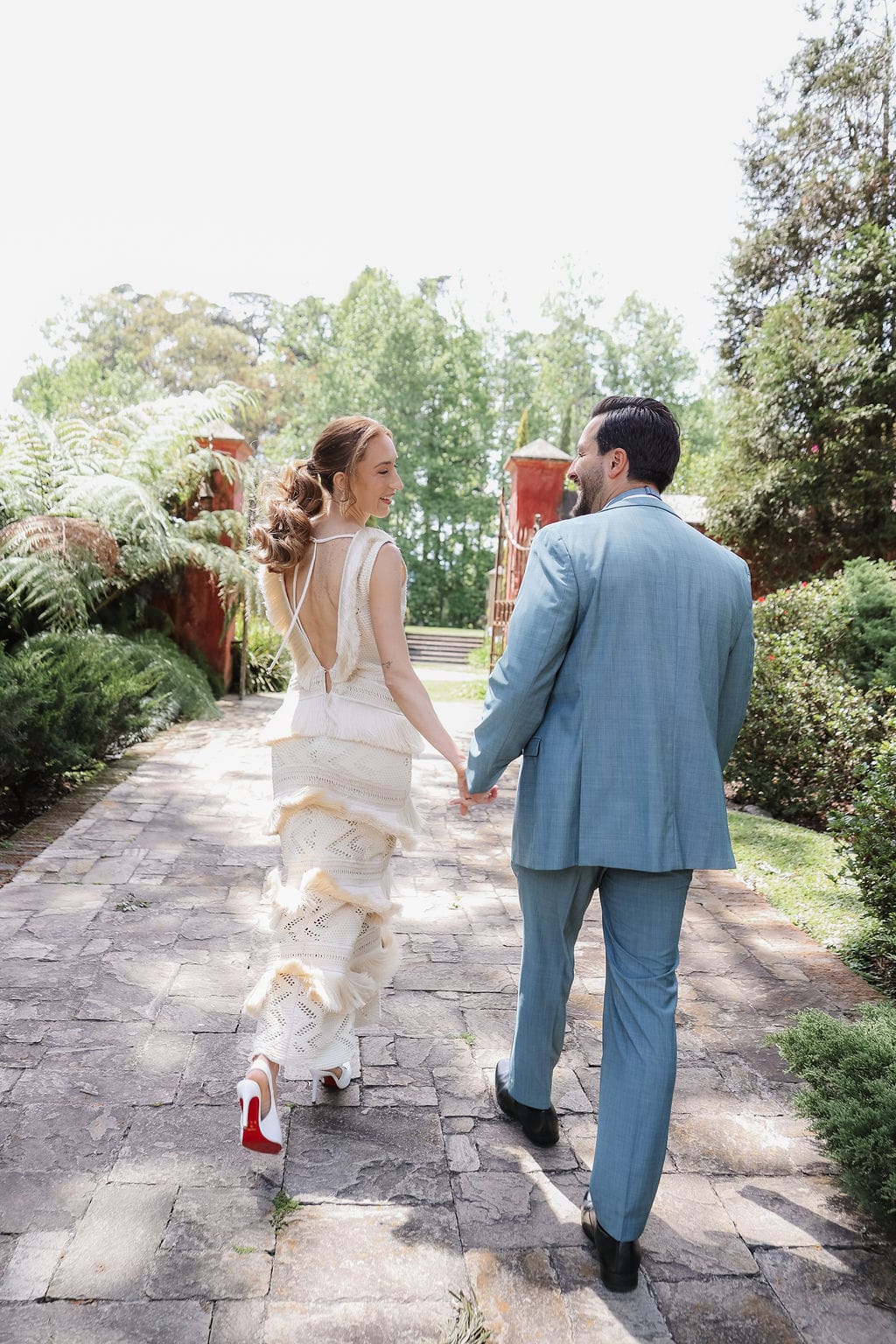 Eternal Horizons: A Bridal Editorial at Hacienda Nueva, Guatemala 12 Walking the cobblestone path · Photography @rydlova_photography