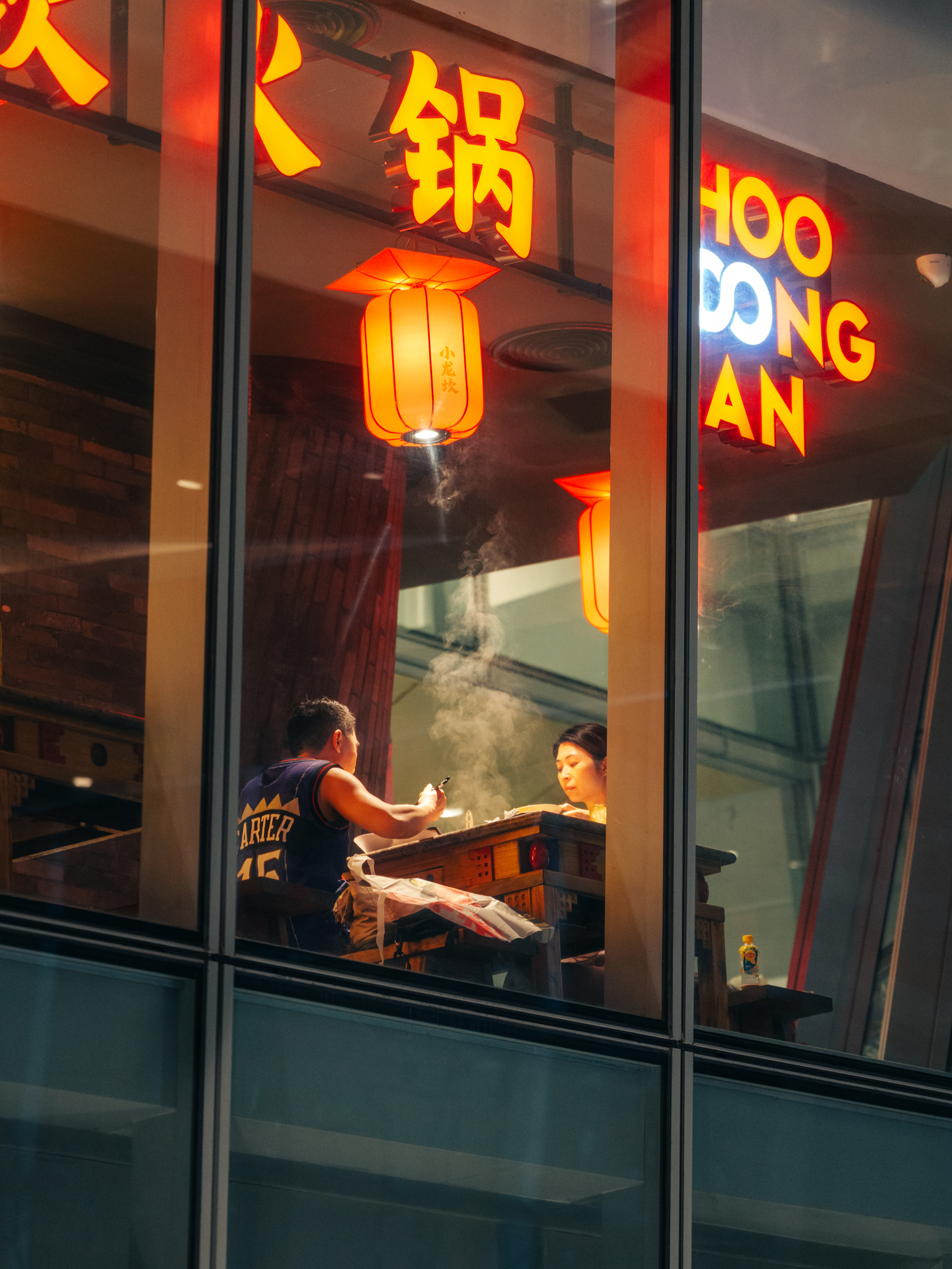 A late-night noodle shop window in Bangkok — the kind of found scene Kostromskikh says he's always drawn to. © Andrei Kostromskikh / Kosnio